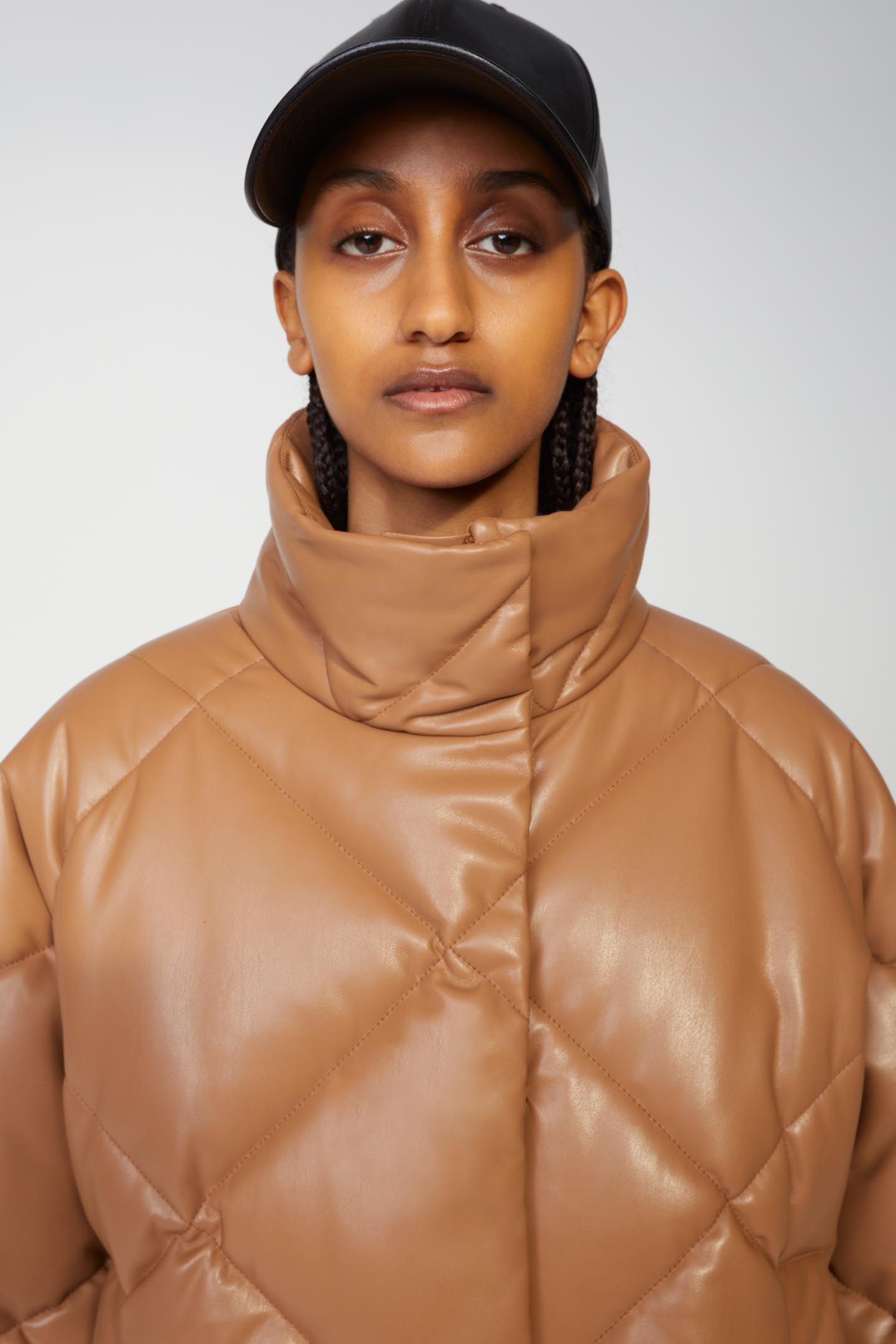 leather jacket and baseball cap